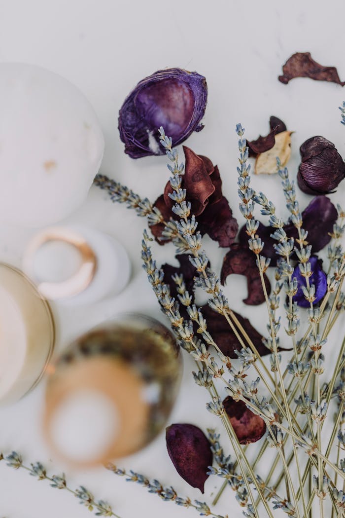 Delicate arrangement of lavender and dried flowers for spa ambiance.